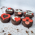 Chocolate cookies with heart-shaped decorations 