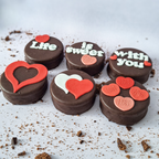 Chocolate cookies with heart-shaped decorations 
