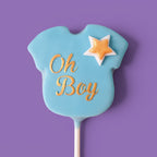 First Cake Pops with baby boy shower themed text " Oh Boy" and stars designs.