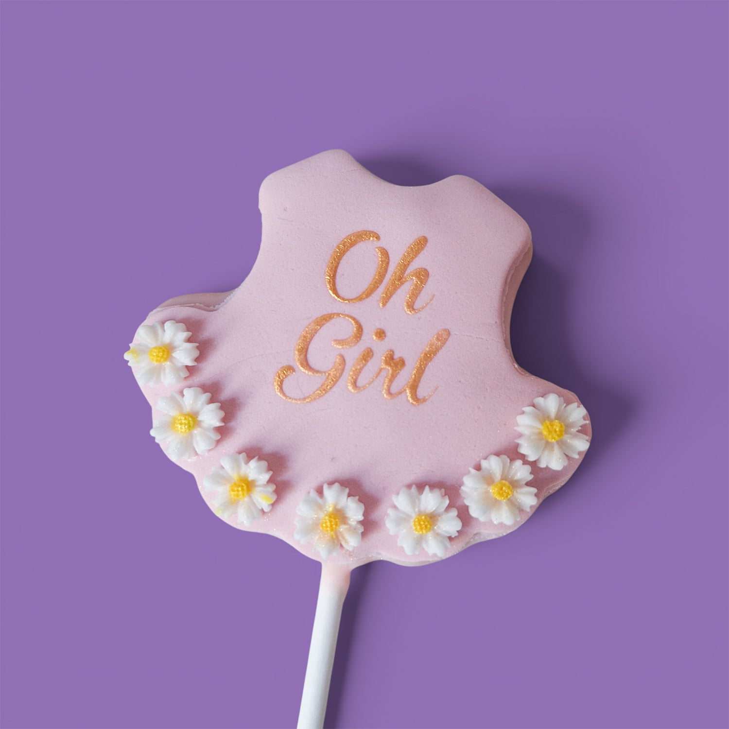 First Cake Pops with baby girl shower themed text " Oh Girl" and daisies flower designs.
