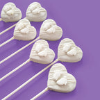 Heart-shaped Cake Pop with a white baby feet design.
