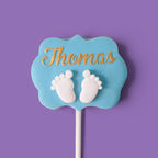 Second Cake Pops with baby boy shower themed text and baby feet designs.