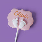 Second Cake Pops with baby girl shower themed text and baby feet designs.