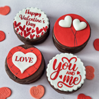 Valentine's Day-themed cookies with red and white icing on a light gray background.